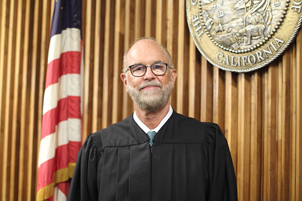 Judge Edward Moreton, a swimmer, finds rhythm, fairness lap after lap