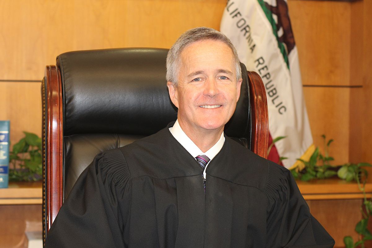 Judge Michael Smyth goes from the presiding judge's office to an overloaded civil courtroom