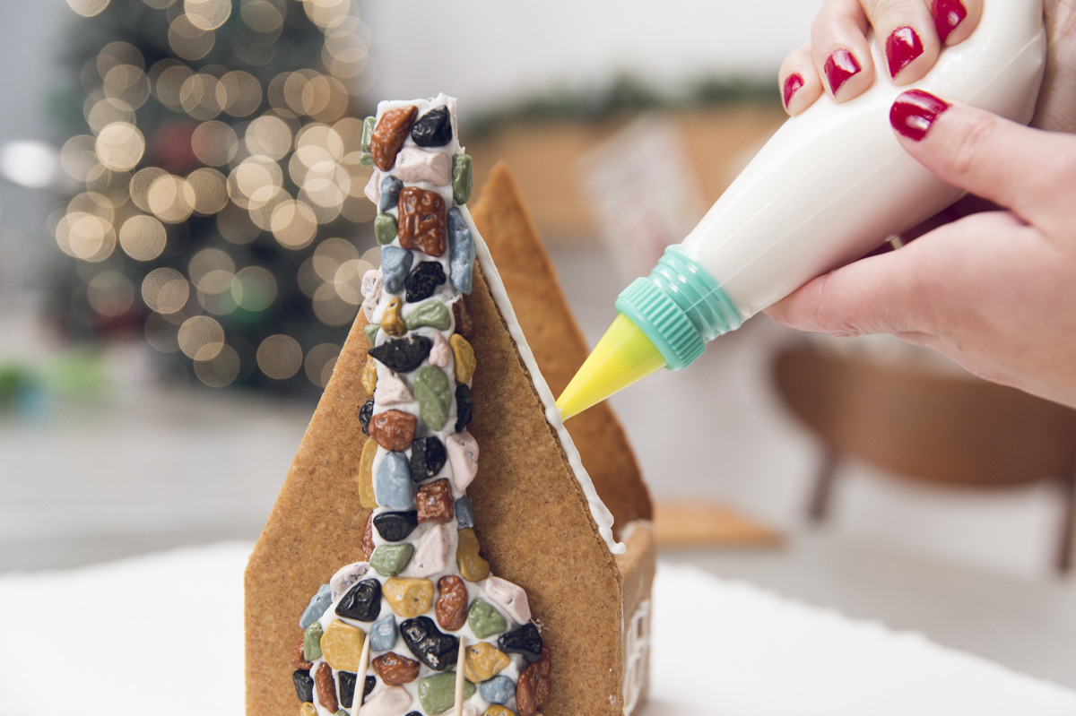 gluing roof on gingerbread house gluing roof on gingerbread house