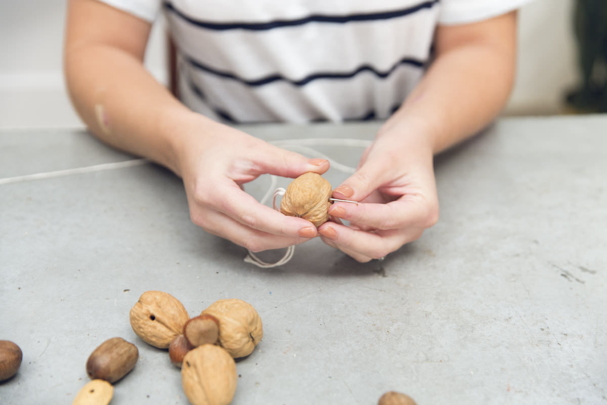 threading needle through garland nuts threading needle through garland nuts