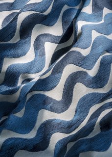 From Sketchbook to Loom, We Reveal How a Brooklyn Designer Created Her New Ocean-Inspired Textile - Photo 3 of 26 - Each finished run of Tidal Wave fabric is stretched across a frame and carefully inspected for imperfections. Any textile that doesn’t meet industry standards is either repaired or, in rare cases, scrapped, depending on the severity of the flaw. Once the fabric passes inspection, it is sent to the warehouse to be sold or made into pillows.