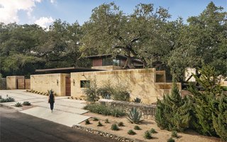 The Olmos Park Residence sits in an established neighborhood in San Antonio. Heavy limestone walls screen neighbors on both sides, while the fourth side opens up to a verdant flood basin.