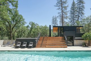 The site already had a pool when Anacapa Architecture began planning the design of the clubhouse. To merge the two structures more organically, the architects introduced stadium-like seating that descends from the clubhouse's second-floor deck down to the pool area.