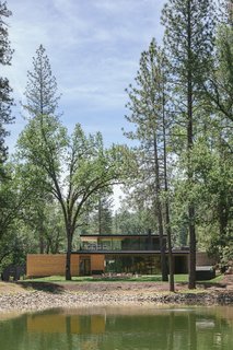 A look across the pond to the clubhouse. At night, guests huddle around the fire pit and swap stories about their day in the park.