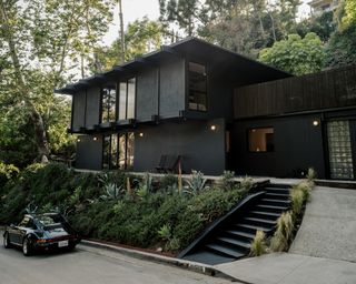 This $2.8M L.A. Midcentury Has an Ink-Black Facade and Bright-White Interiors