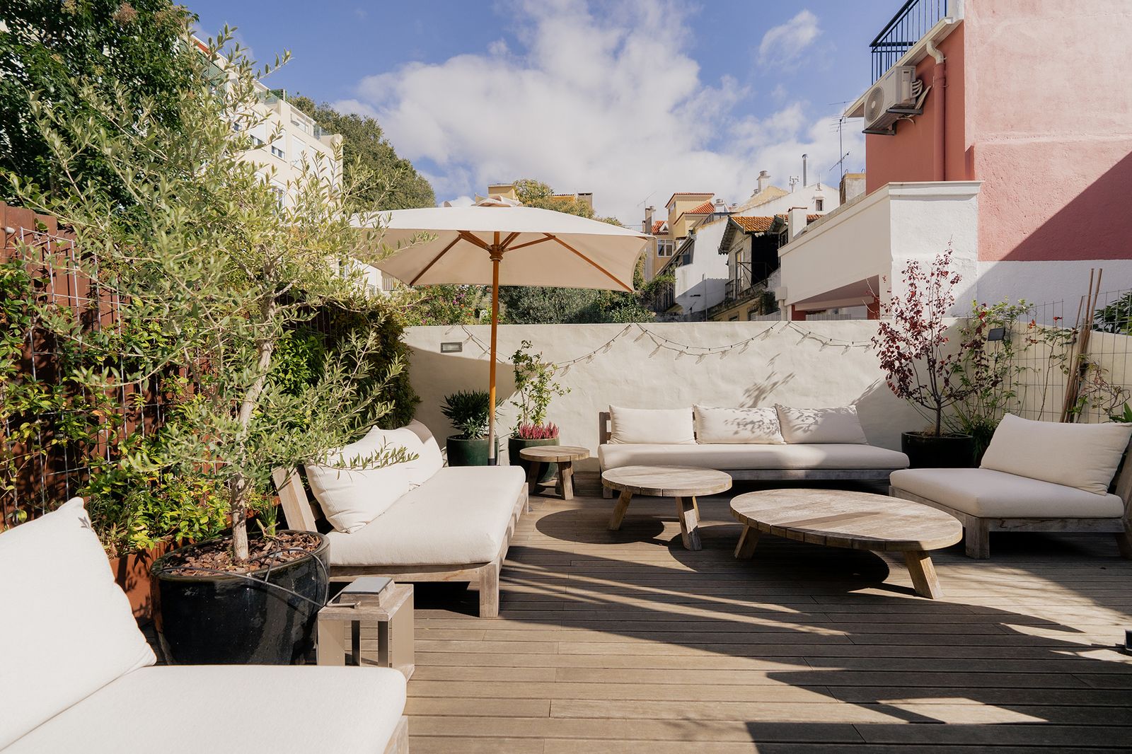 This revamped two-bedroom flat has warm, minimalist interiors and a 753-square-foot terrace for soaking up Lisbon’s sunny weather.