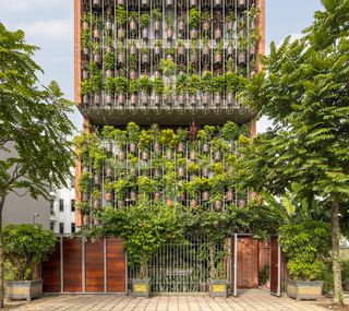 More Than a Hundred "Floating" Plants Form the Front of This Vietnamese Home