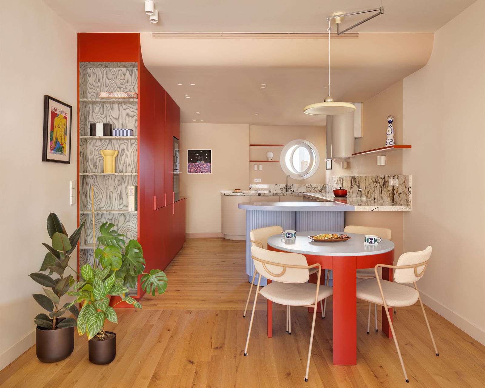 A pastry chef and a perfusionist splurged on bespoke cabinetry and fluted glass to fill their run-down Barcelona flat with light, color, and curves.
