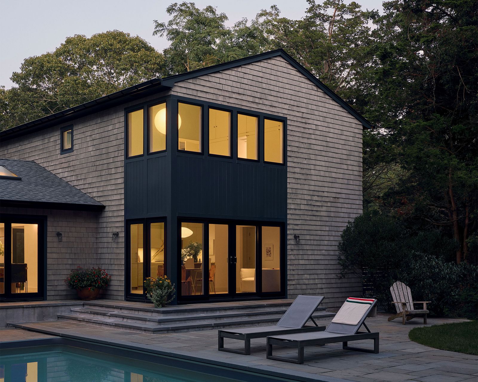 Architecture in Formation gave a shingle-style ’90s home a well-needed refresh by reworking the layout, updating the material palette, and adding bold pops of color.
