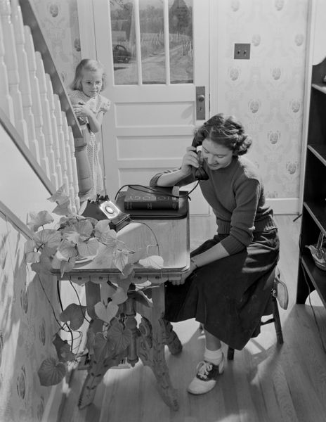 People often displayed their household landlines on small tables or built-in nooks near the entryways or parlors of their homes.
