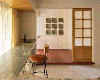 Before & After: Curvy Cabinetry and Minty Marble Refresh a Former Bachelor Pad in Mumbai