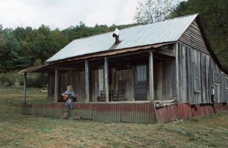 Dolly Parton Never Left Her Childhood Home Behind. We Shouldn’t Either