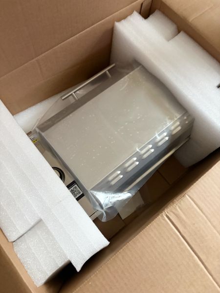 The grill was packed snug in its box.