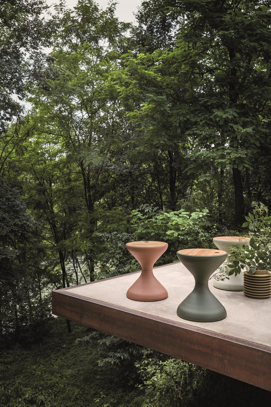 The Bells round side table with an ice bucket insert, also designed by Pedersen, is an elegant, sculptural form with an emphasis on function.