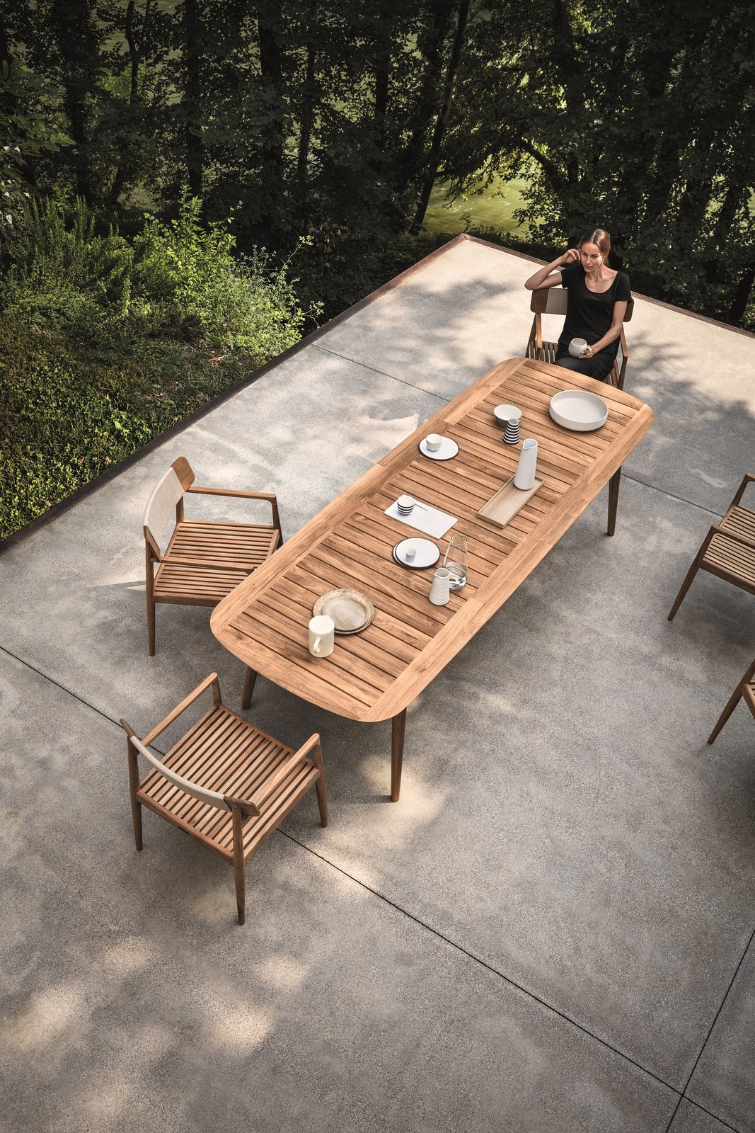 Inspired by teak decking, and echoing the craftsmanship and design of the Tea Clippers that opened trade routes around the world, Pedersen clearly references his inspiration, using generous deck-like slats, finely tapered legs that hint at a ship’s mast—even giving the table a hull-like edge. The Clipper collection is simultaneously a nod to a nautical past, as well as a new take on al fresco dining.