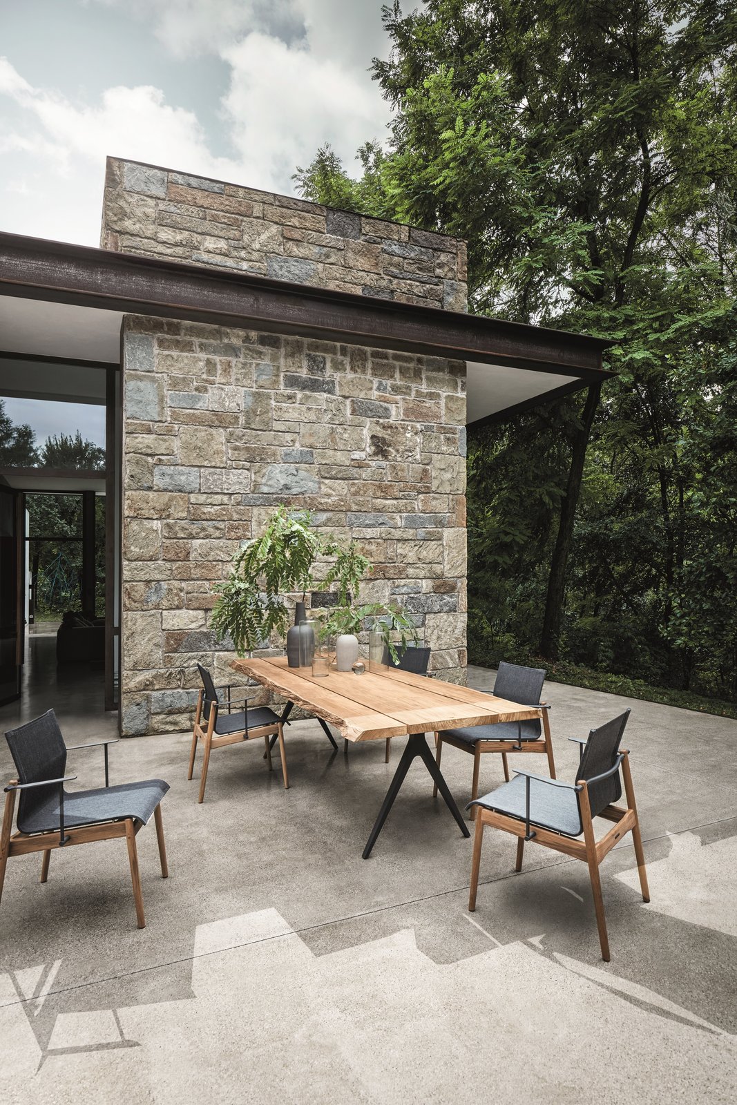 Gloster’s wood can always be traced back to its origin, and the company only harvests teak that it has planted. The Raw Split Dining table with a contoured edge by Pedersen is a contemporary, unfinished, minimalist design with a strong emphasis on the materiality. A close-grained hardwood with a high natural oil content, teak is exceptionally hard wearing, highly resistant to rotting, and almost impervious to the effects of sun, rain, or snow.