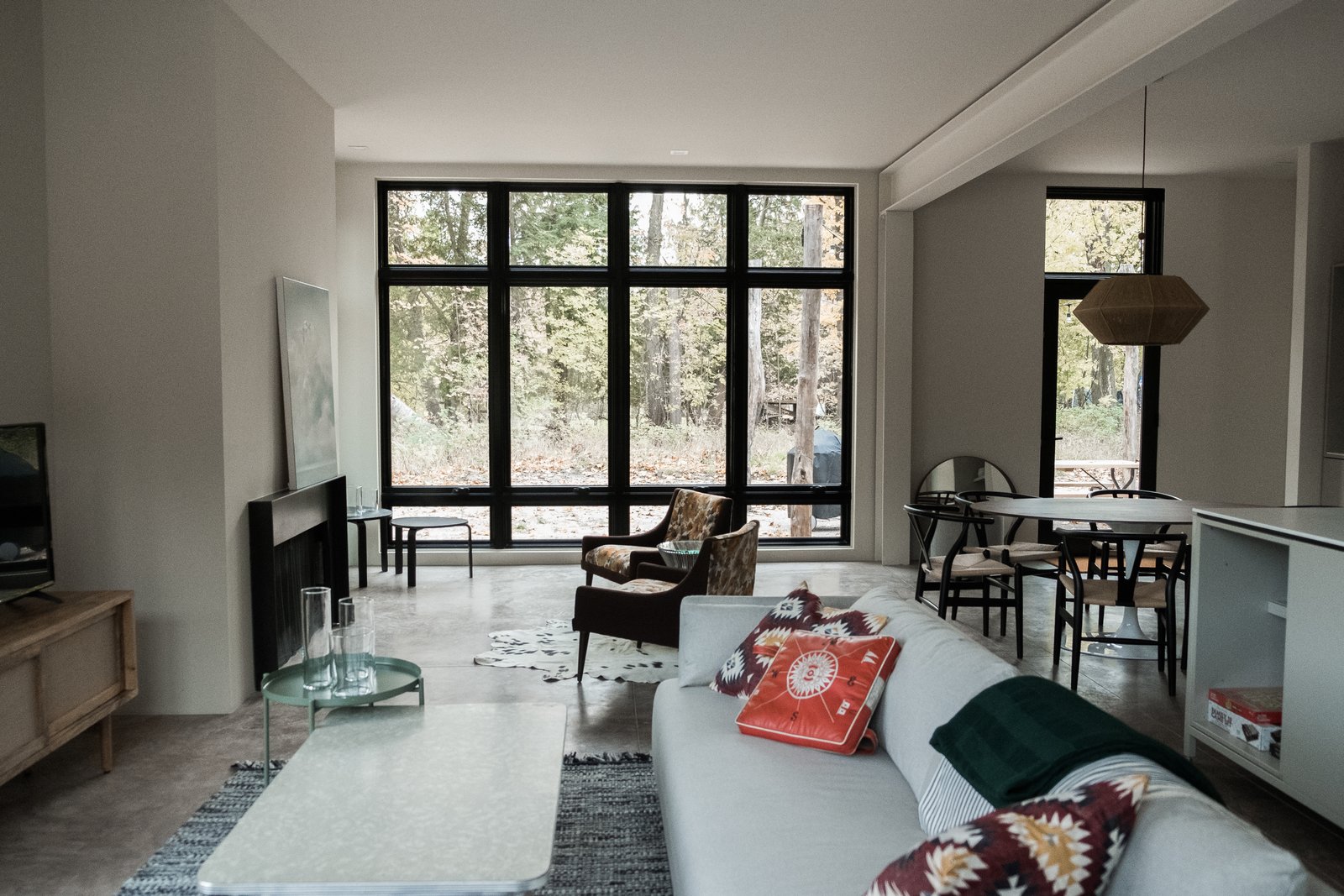Great room with floor-to-ceiling windows.
