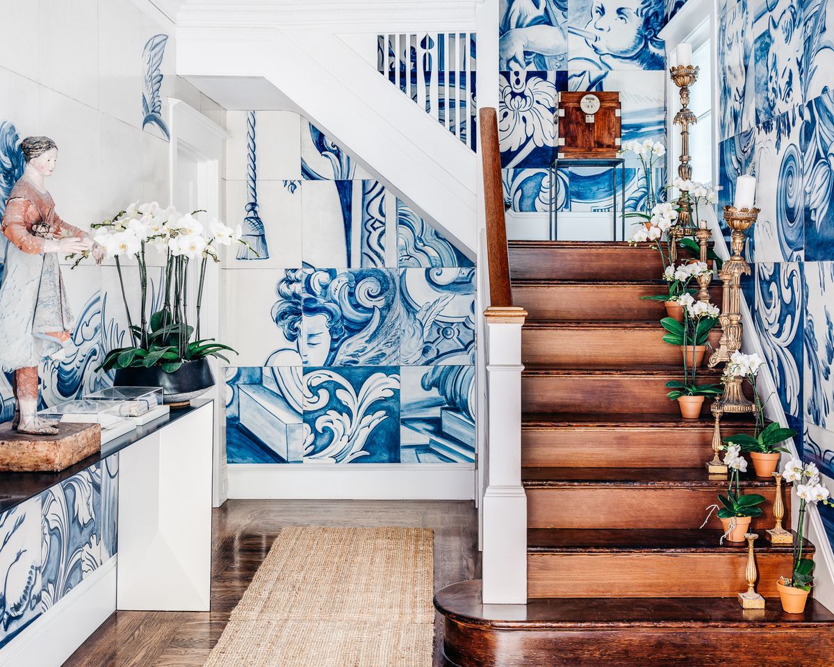 Originally built by an Italian sculptor, the renovated residence features intricate plasterwork, a Juliet balcony, and a converted art studio.