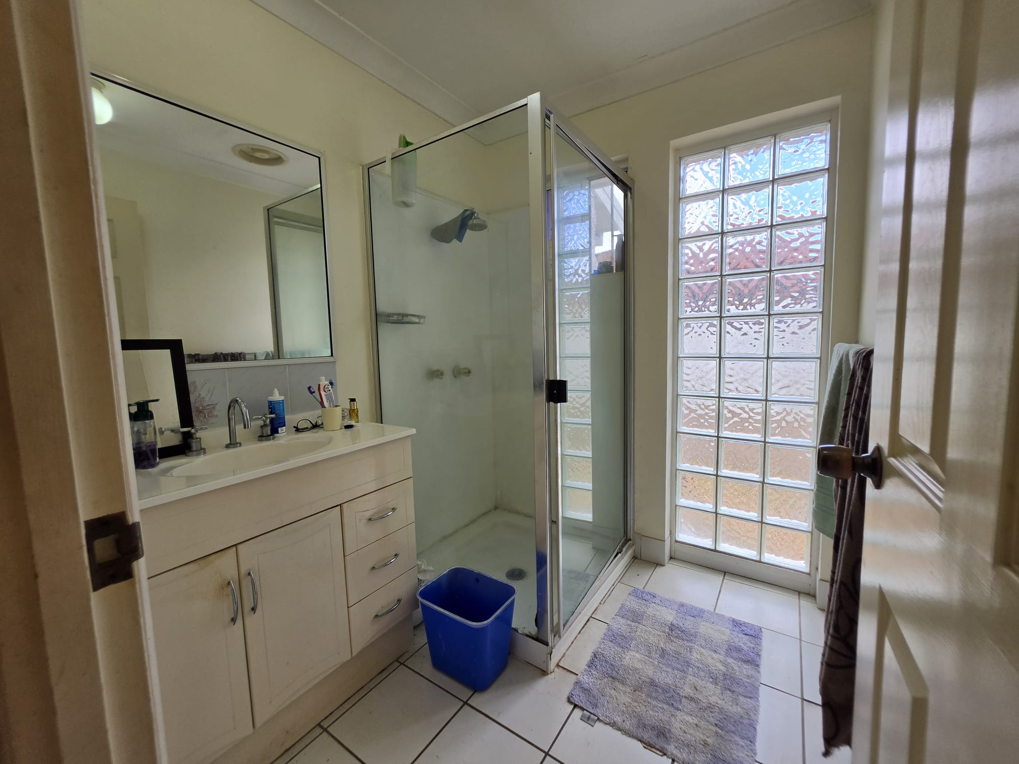 Bathroom with shower and vanity