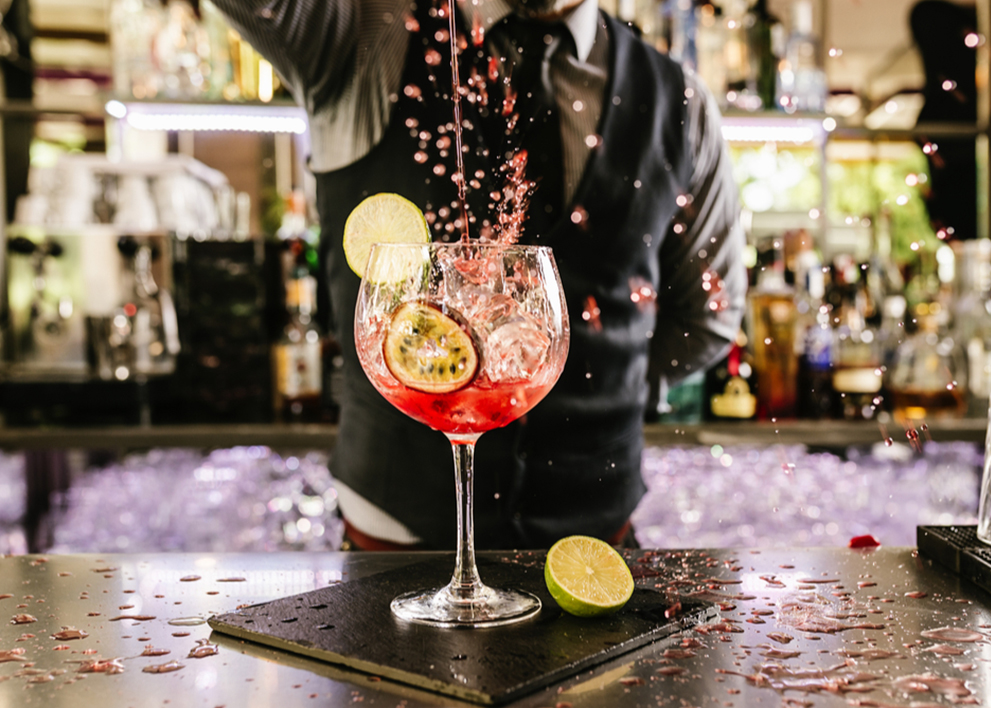Image of a bartender mixing a cannabis-infused cocktail