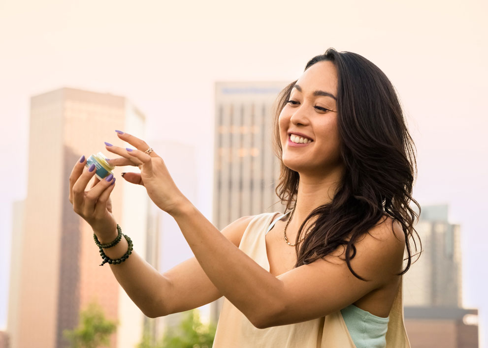 Woman applying a marijuana topical
