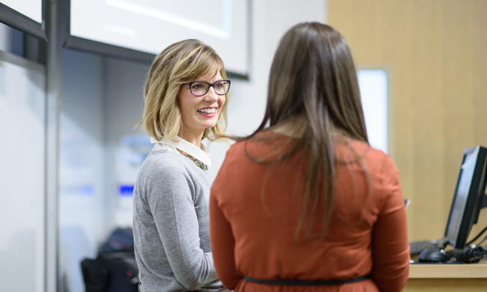 9 Professor speaking with student
