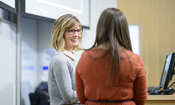 Professor speaking with student