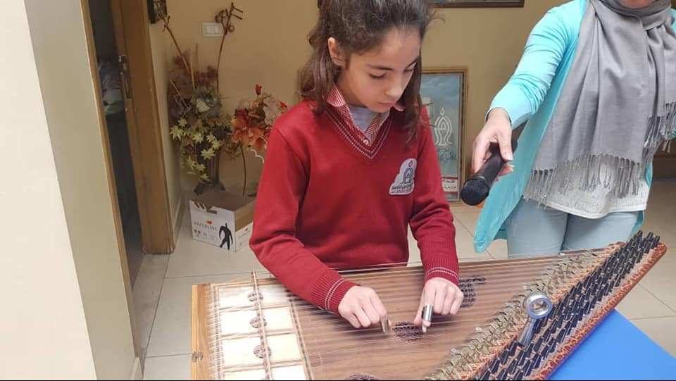 Playing the Qanun when I was 12, for the opening of a Historical Exhibition at our school.