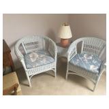 two wicker chairs and table