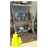 Etal bakers rack full of pottery