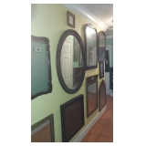 Hallway full of mirrors & artwork