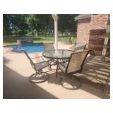 patio set with glass-top table