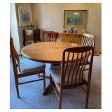 Teak dining & 4 chairs. Comes with 2 leaves