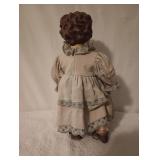  dolls shows some age ware Doll in yellow dress hair is thin and missing some hair in the front .