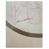 has a small black marker stain in the upper right  and a stain and some small holes in the back pape