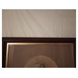 Pre Owned the back has some tape on the back  of the wood 