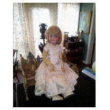 Ant germsn doll on victorian metal bench