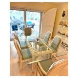 Rattan dining room table with glass top and 6 cushioned seats