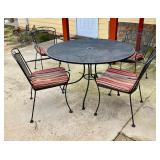 Round metal table w/four chairs