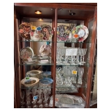 Curio cabinet full of beautiful waterford crystal and other china