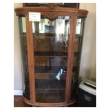 Antique Bow Front, solid oak. Hairline crack on one pane of glass.