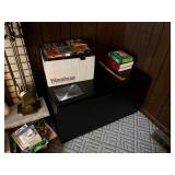 black TV cabinet, dvds and tapes