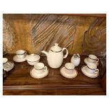 white and gold china tea set