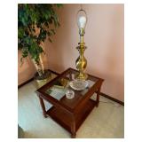 glass and wood table, brass lamp