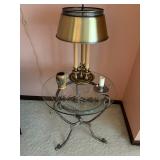 Glass and iron table with brass lamp
