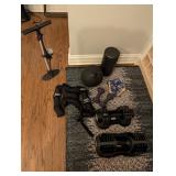 Assorted workout equipment (weights, weighted vest, medicine ball)