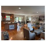 Gray Fabric Armchairs: A matching pair of square-framed armchairs in textured 