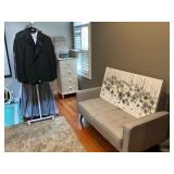 Couch, artwork and clothing