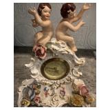 “Vintage German porcelain figural mantel clock (VI mark), mid-20th century, with mechanical back mov