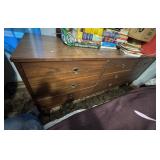 4 pc, Brown Wooden Dresser. 9 Drawers with circular recessed metal handles.